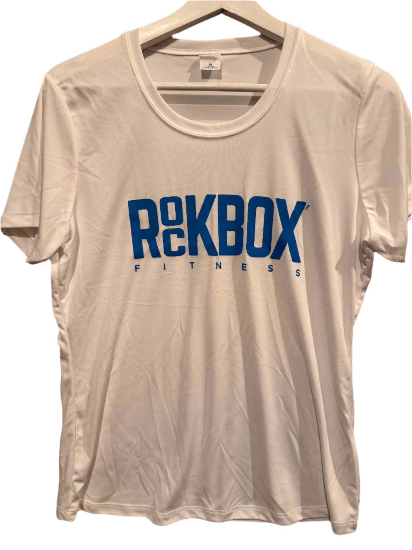 White t-shirt with 'RocKBOX FITNESS' text on a gray surface
