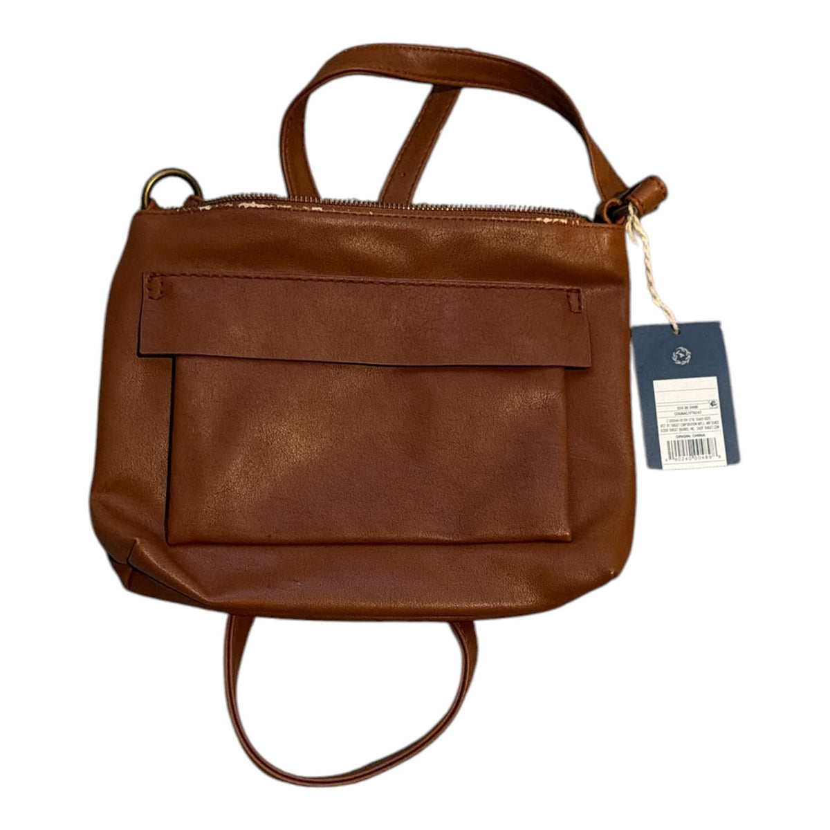 The Xchange brown faux leather crossbody bag with a front pocket, top-zip closure, and adjustable shoulder strap.
