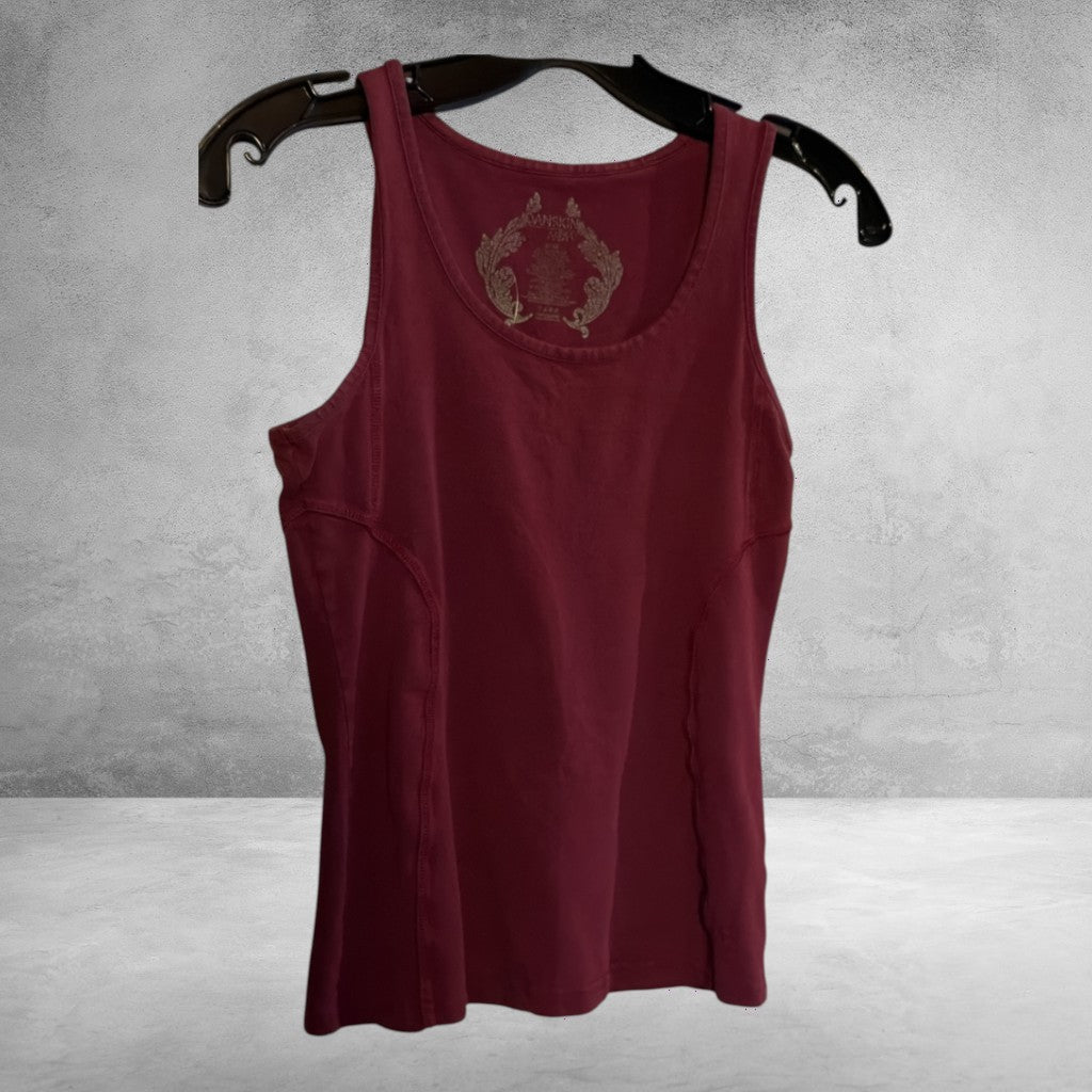 The Xchange Danskin Now burgundy athletic tank top with a scoop neckline and reinforced side seams on a hanger