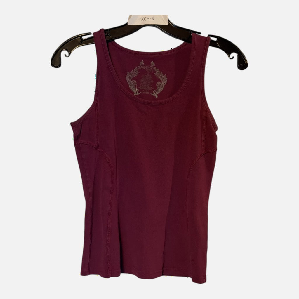 The Xchange Danskin Now burgundy athletic tank top with a scoop neckline and reinforced side seams on a hanger.