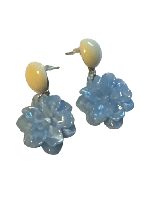 The Xchange blue and cream flower drop earrings with translucent petals and cream bead tops.