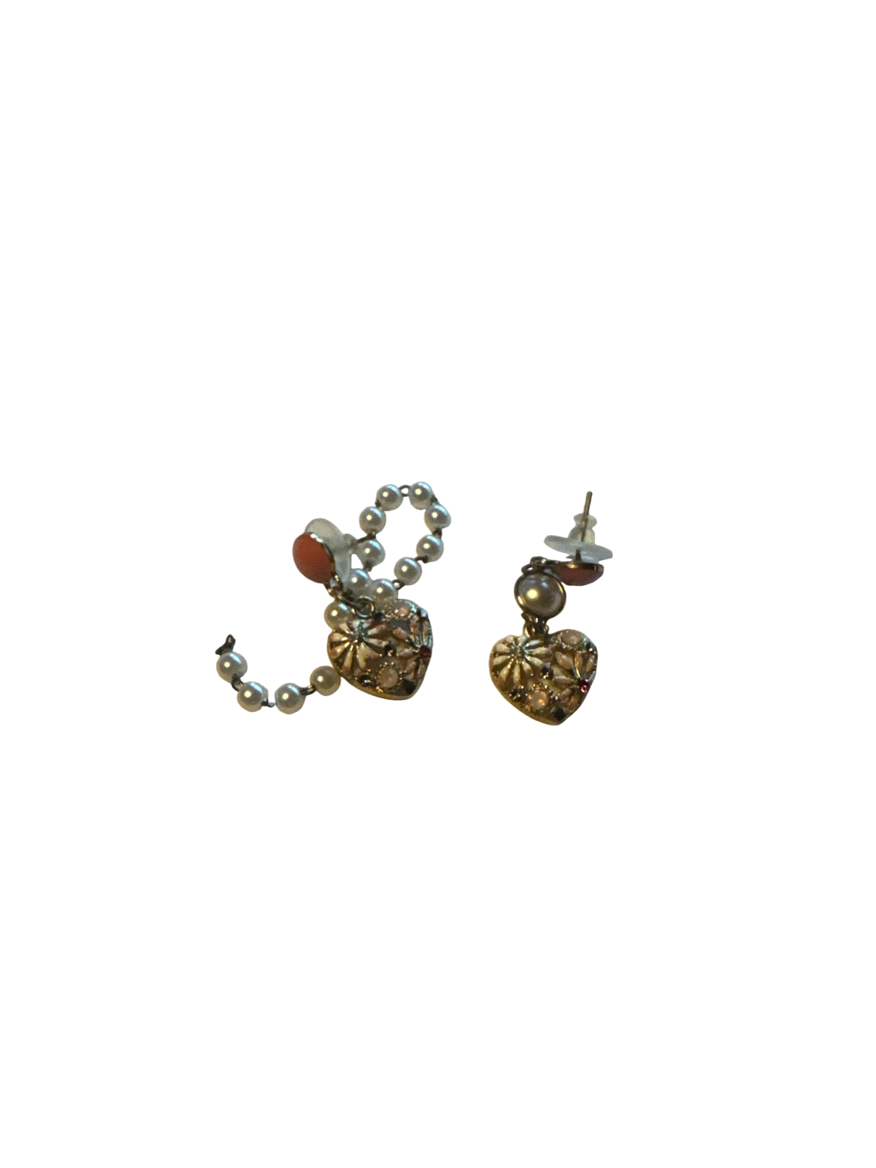 The Xchange pink and gold heart-shaped seashell earrings with pearl accents and small red gems.