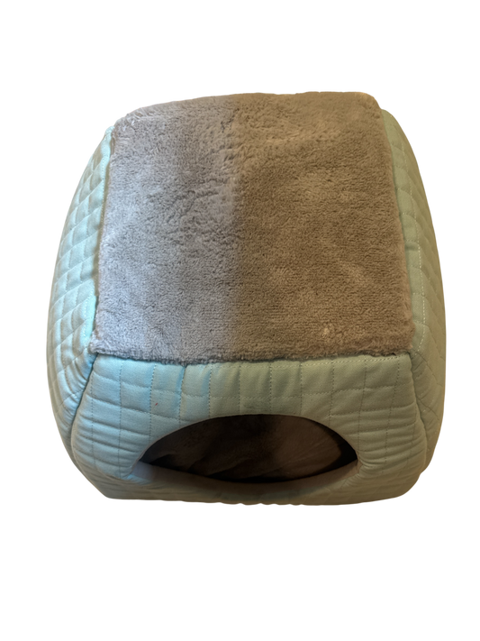 The Xchange small plush pet bed in light blue with a grey fuzzy interior and quilted exterior.