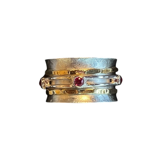 The Xchange Synthetic Garnet & Two-Tone Band Spinner Ring, size 7, features a red synthetic garnet and a textured two-tone band.