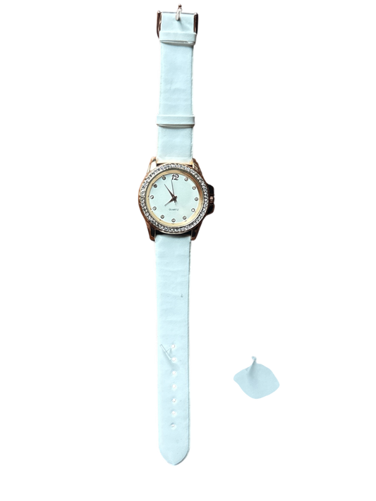 The Xchange white leather quartz watch with gold-tone case and zircon-embellished bezel.