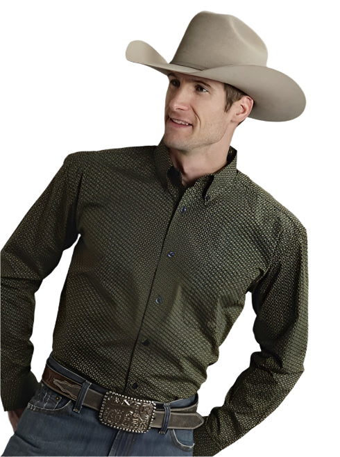 A person wearing a brown cowboy hat and a green shirt with a pin wheel print, paired with blue jeans.