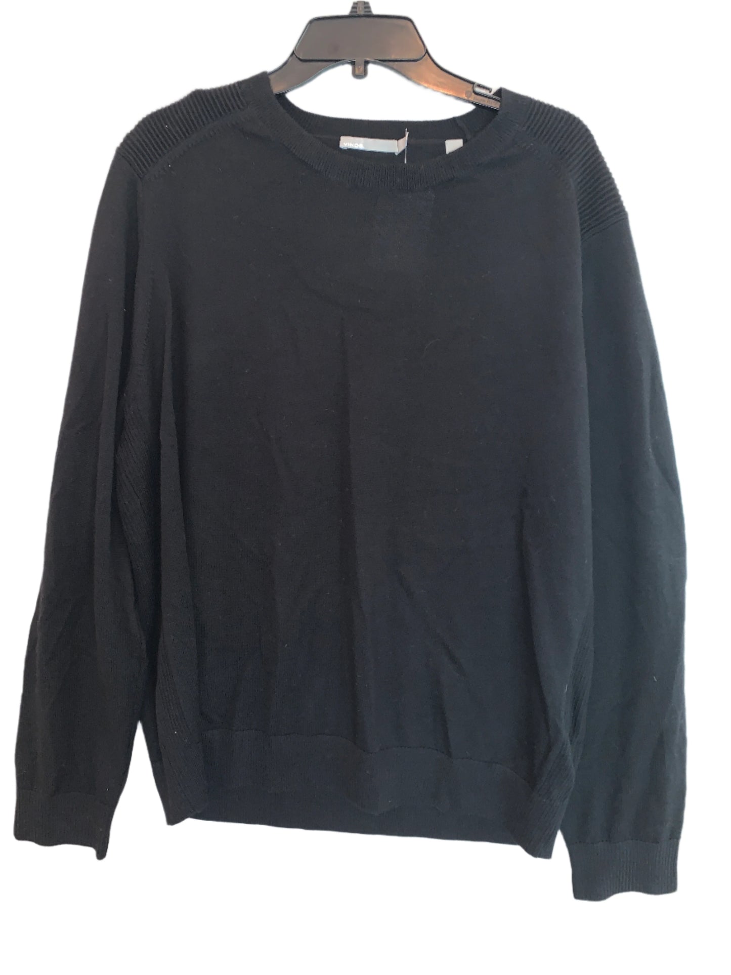 Black merino wool crew neck sweater, displayed on a hanger, with no visible brand marking.